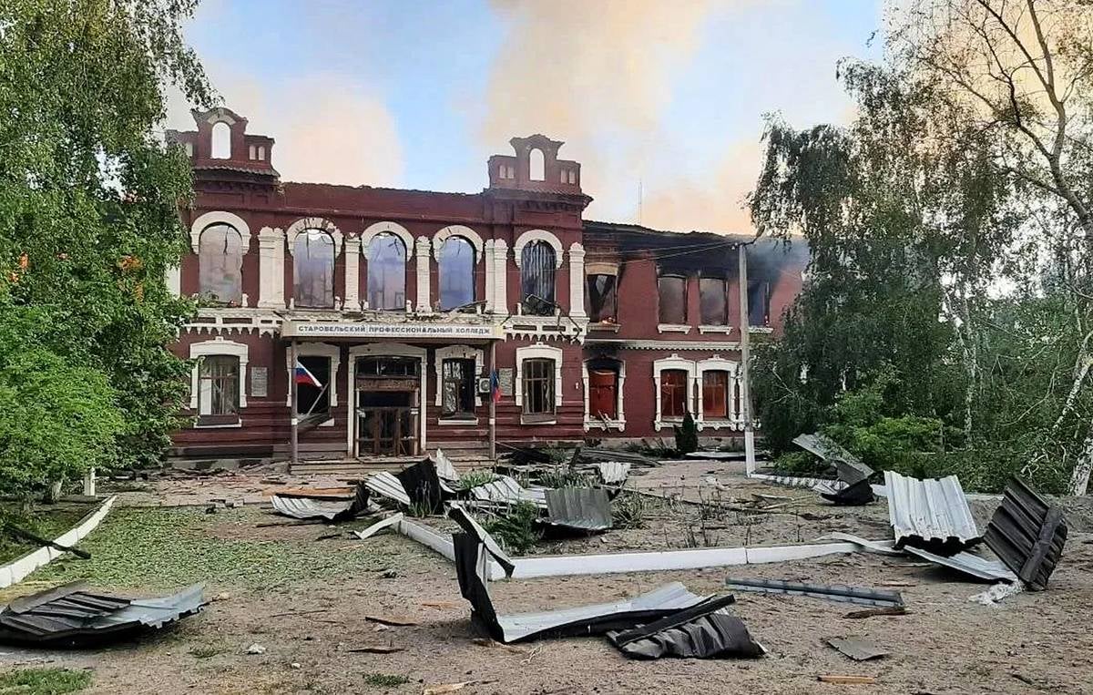 Russian rescue teams work amid rubble at Starobelsk Professional College after Ukrainian drone strike May 22 2026