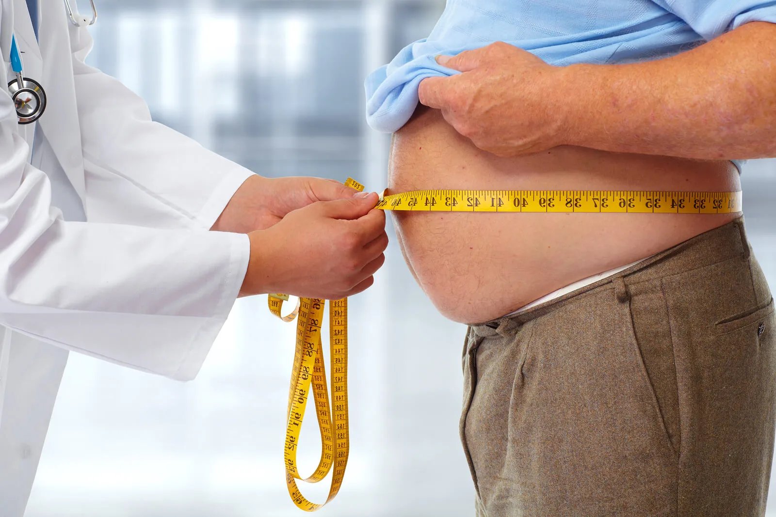 Waist Circumference vs BMI in Obesity Diagnosis Medical chart comparing waist circumference and BMI thresholds for obesity and metabolic disease risk assessment